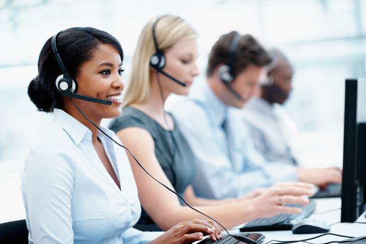 Business people with headset on working in a call center